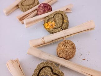 Hanging rabbit treats with calendula, timothy hay, rose, apple sticks, and bamboo